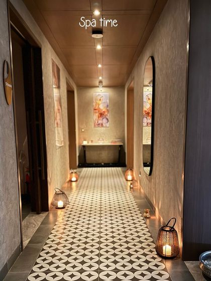 The candlelit corridor of Ksema Spa, as captured by a guest. This image shows how I use light and shadow to create a dramatic and serene pathway, transforming the walk to a treatment into a beautiful experience in itself.