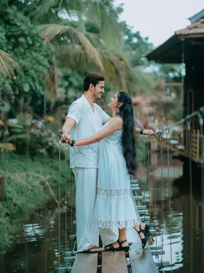 A romantic pose on a rustic rope bridge. This photo of Suchita and Om Prakash, surrounded by water and greenery, feels like a scene from a storybook.