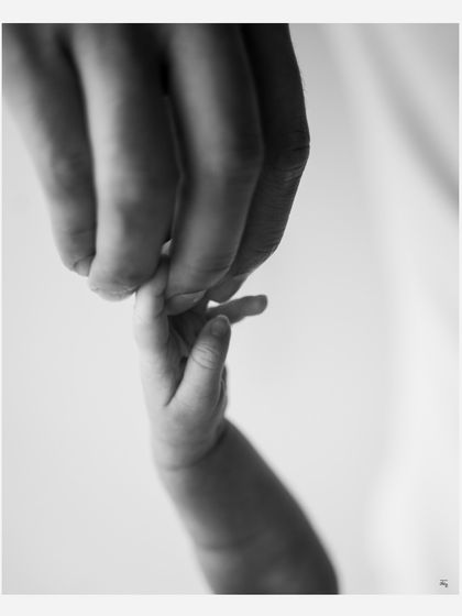 The tiniest, most delicate grasp. I love creating these simple, powerful images that focus on the connection between parent and child.