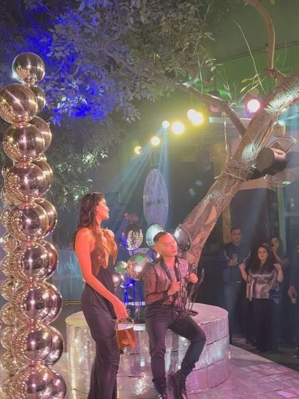 The atmosphere at the outdoor fashion show was electric, combining nature with high fashion.