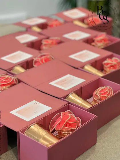 These drawer-style boxes in a lovely rose colour are a sophisticated choice for return gifts. They can be filled with small keepsakes or treats, and the box itself becomes a cherished item.