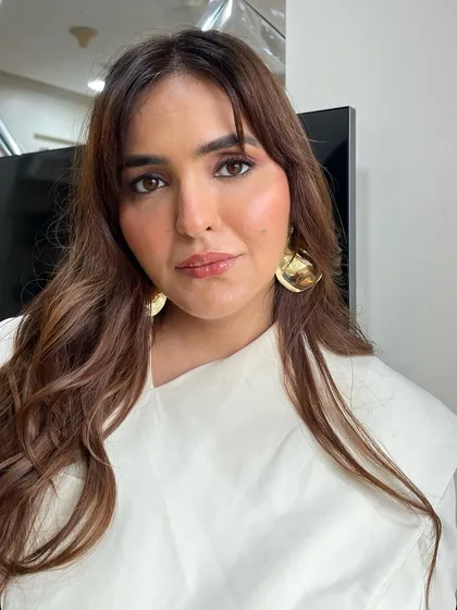 This is a perfect example of my professional headshot makeup. I created a soft, natural glam look with a subtle smoked liner and a neutral lip to give my client a confident and polished appearance for her interview.