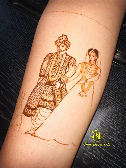 Step three: adding the intricate patterns and shading to the groom's attire. This layering technique is what creates depth and a rich, designer look in your mehandi.