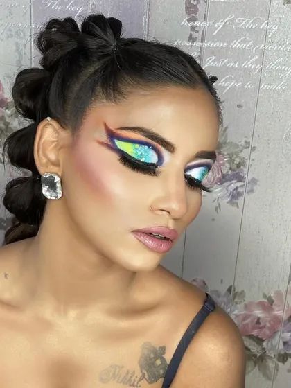 Another angle of the high-fashion bubble braid and graphic eye look, showing the details from the side.