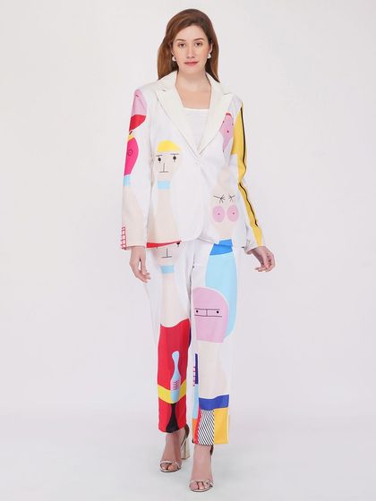 A full-length shot of a model in a creative, multi-colored pantsuit. We ensure the fit and pattern are displayed clearly for customers evaluating the entire outfit.