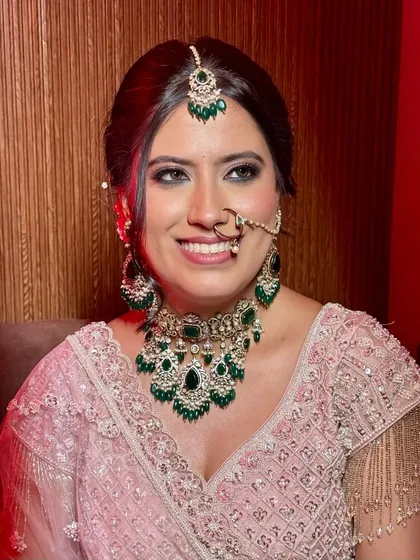 Grace in every gaze, sparkle in every detail. A bride wrapped in blush dreams and timeless charm, her smile says it all.