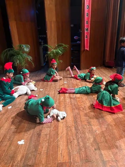 Santa's elves take a break during rehearsals, getting ready for the big Christmas show.
