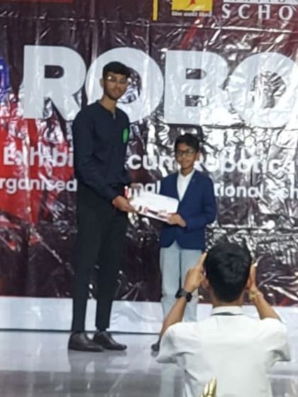 Another one of our students is recognized on stage at the Gopalan Robotics Competition. These events are fantastic opportunities for kids to gain stage presence and confidence in their technical abilities.