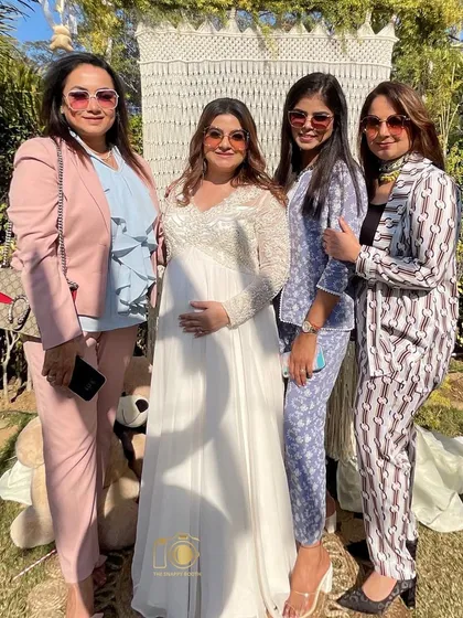 The ladies celebrating the mom-to-be in style. A photo booth is a must-have for creating fun, memorable moments at a baby shower.