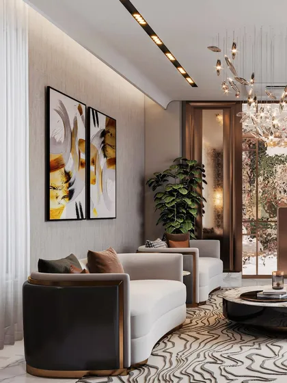 This angle highlights the room's thoughtful layout, showing how curved seating and curated art create a sophisticated yet comfortable conversation area. The play of light and shadow adds depth to the scene.
