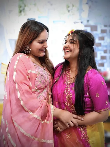 Laughter and joy are the heart of pre-wedding ceremonies like the Haldi. We blend into the background to capture these natural, happy interactions between the bride and her loved ones, focusing on authentic emotions.