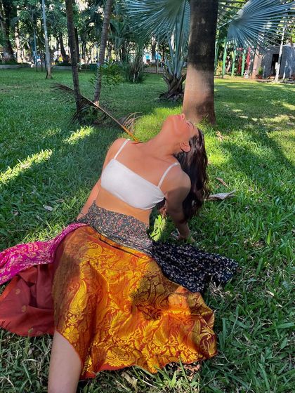Just enjoying a moment in the park, wearing a beautiful patchwork skirt made from old sarees. This is a great example of sustainable and unique fashion.