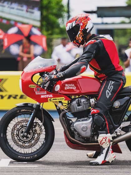 A rider on the starting grid of the GT Cup, focused and ready for the race to begin.