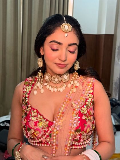 A close-up of Neha's Haldi eye makeup. The monochromatic pink look is modern and perfect for a fun, daytime event.