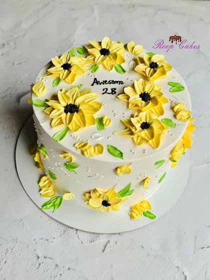 Blooming into 28. This 'Awesome 28' cake is covered in cheerful, hand-piped sunflowers.