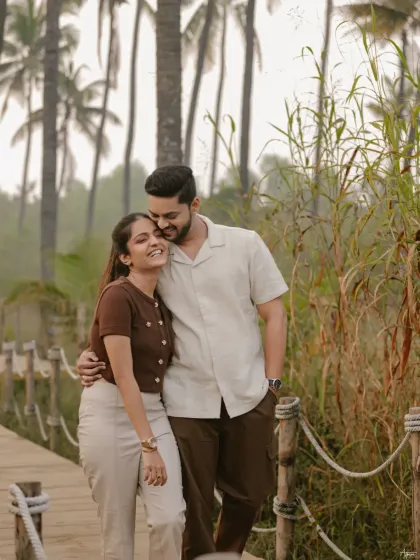 A sweet and affectionate portrait of Vinay and Yachi. His gentle embrace from behind and her happy, relaxed expression make for a heartwarming and authentic moment.