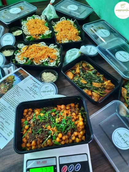 Weighing and packing orders of kelichana, singju, and pork with mustard leaves to ensure every customer gets a generous portion.