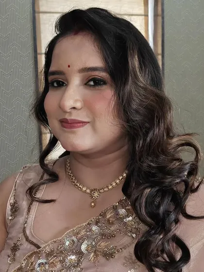 A close-up showing the details of the soft curls and the subtle, glowing makeup. This is a great example of my 'your look, your way' philosophy.