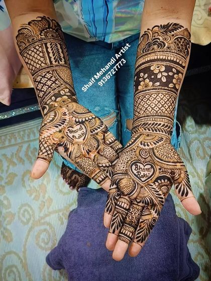 A special Raksha Bandhan design with 'Bharat Rakhi' written inside a heart. This shows how I can customize mehandi for any occasion.