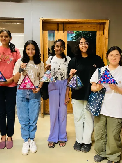 A group of our older students proudly displays their finished Diwali lanterns. Each one is a unique expression of their creativity.