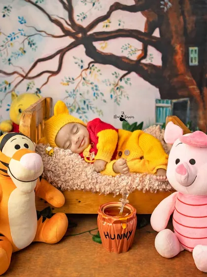 Another angle of our adorable Winnie the Pooh, capturing the full scene with Tigger and Piglet watching over him. The hand-painted backdrop adds to the storybook feel.