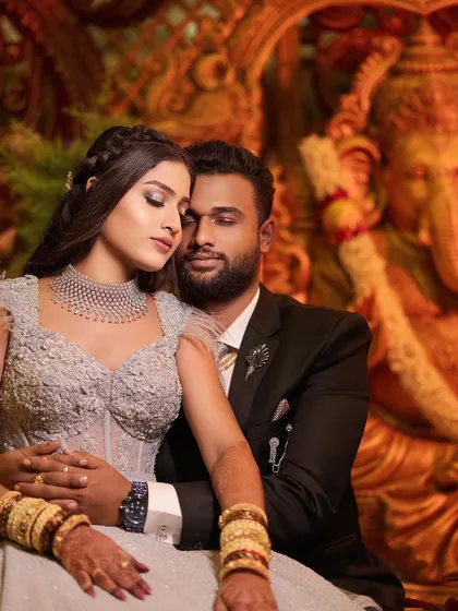 A modern couple sharing an intimate moment during their wedding reception. I use creative lighting and composition to create glamorous and romantic portraits that showcase contemporary wedding attire and decor, providing a beautiful contrast to traditional ceremony photos.