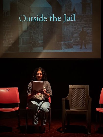 An actor reads from her script during a rehearsal for "Inherit the Wind."