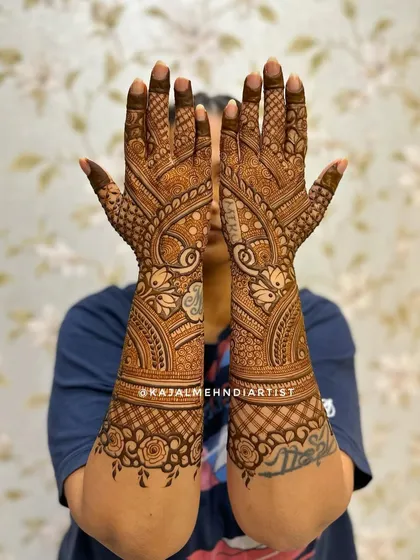 An Indian backhand design with peacock and floral elements.