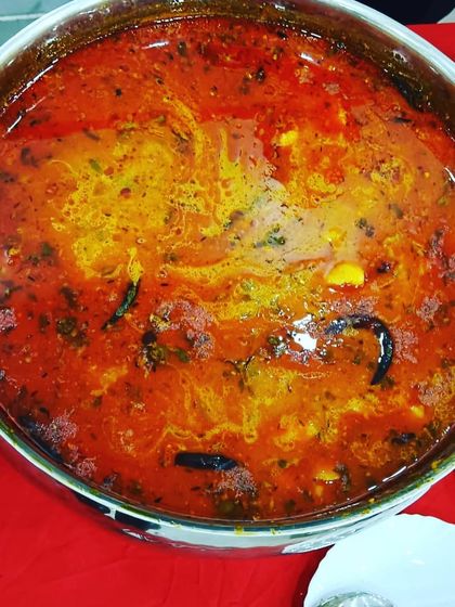 A close-up of a rich and flavorful vegetable curry, slow-cooked with a blend of aromatic spices. This is the kind of hearty main course that guests love.