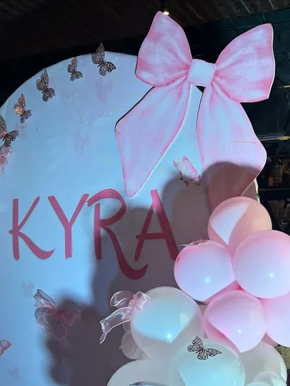 The oversized pink bow prop is the perfect statement piece for this adorable and stylish half-birthday party.
