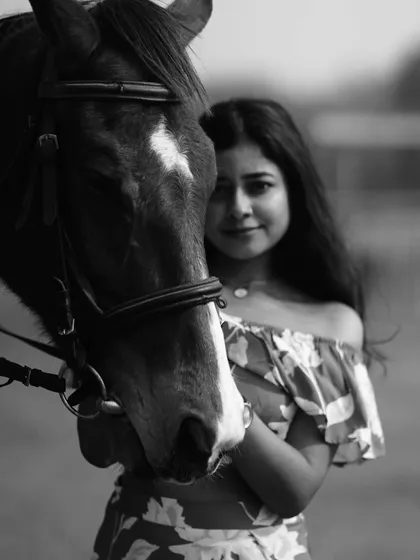 A powerful black and white close-up, focusing on the textures and the intimate bond between human and animal.