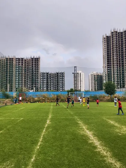 A training match under a cloudy sky. We play in all conditions, building resilience and adaptability.