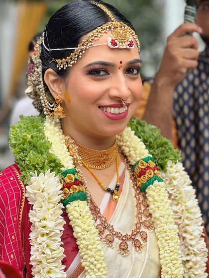 A happy candid of the bride during her wedding ceremony. Her makeup looks fresh, natural, and radiant.