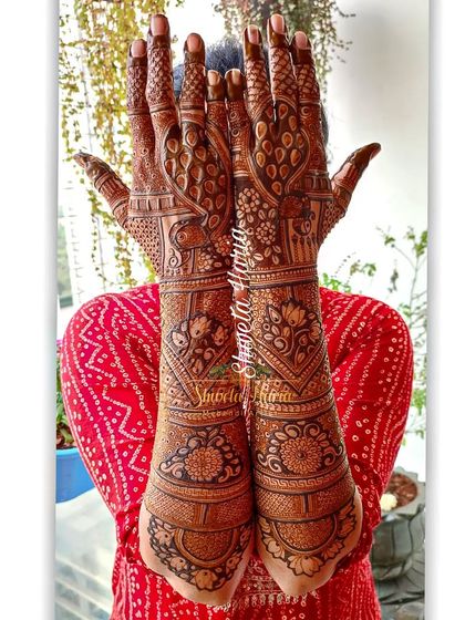 A heavy Indian back-hand design with a mix of peacock, floral, and geometric patterns, offering a classic and full look.