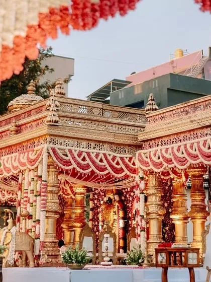 This is tradition with the volume turned all the way up. We designed this opulent temple-style mandap to feel like a sacred monument, using intricate golden pillars and dramatic floral arrangements for a truly royal muhurtham.