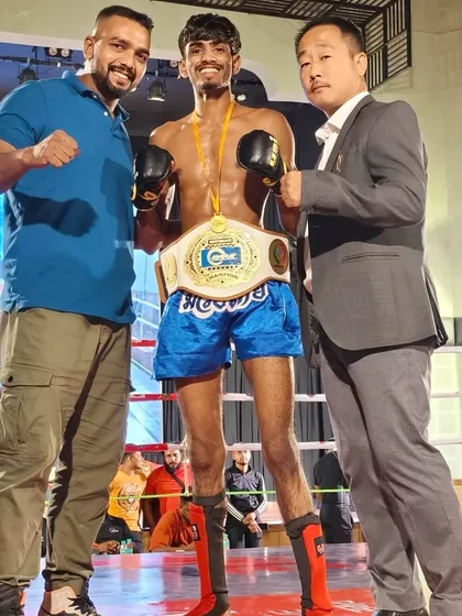 Another shot with the title belt. We travel, we compete, and we bring home the gold.