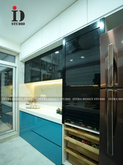 A detailed look at the vertical storage unit with a sleek black rolling shutter and integrated pull-out baskets, designed for easy access and organization.