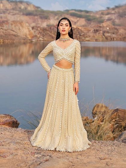 This selection showcases the breadth of my bridal and couture curation. It includes a variety of lehengas, gowns, and sets in different colors and styles, from traditional reds by Anupraas to modern ivories by Mirroir and Varun Chakkilam, ensuring every bride finds her perfect look.