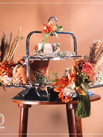 A full view of the Lohri hamper on its serving stand, ready to be the centerpiece of a festive gathering. The combination of rustic and polished elements gives it a unique charm.