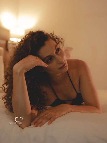 A thoughtful and pensive moment. The soft lighting and her expression create a beautiful, story-rich image that feels both personal and universal.