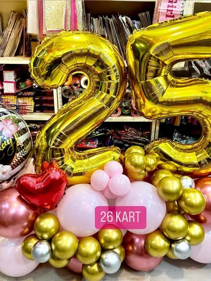 Celebrating a 25th birthday is a big deal, and this custom balloon bouquet is one of my most requested items. It features large foil numbers and a coordinated color palette of gold, pink, and rose gold, perfect for photos.