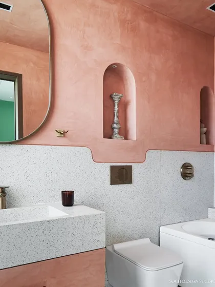 A Japandi-inspired bathroom design that focuses on sustainable and water-resistant materials like terrazzo and micro-concrete. The space combines the rustic charm of natural textures with clean lines and warm tones to create a spa-like sanctuary at home.