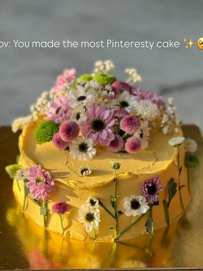 A full view of the "Pinteresy" cake that made me so happy. The combination of butter-yellow frosting and a meadow of fresh flowers is just so cheerful.