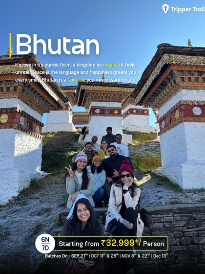 A group of happy travelers posing at Dochula Pass in Bhutan, with its 108 memorial stupas. This poster captures the magical and peaceful essence of our 6-night, 7-day journey through the kingdom.