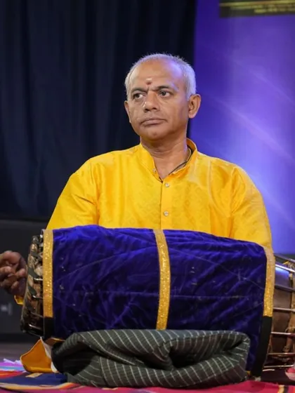 The focused expression of our mridangam Vidwan Gurumurthy during the Keerthana performance.