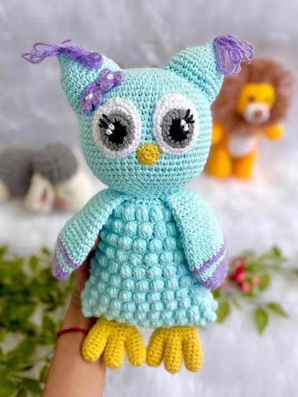 A beautiful collection of baby's first toys, including a gentle giraffe, a wise owl, and a brave lion. All are made with baby-safe materials.