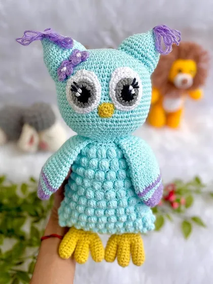 A beautiful collection of baby's first toys, including a gentle giraffe, a wise owl, and a brave lion. All are made with baby-safe materials.