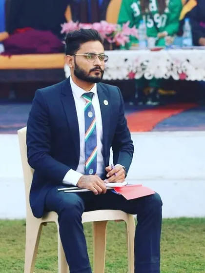 Taking notes during a competition. I constantly analyze performances to refine our training methods and give my students the best possible guidance.
