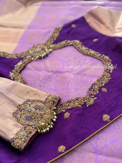 A purple and gold blouse with a heavily embroidered back and sleeves.