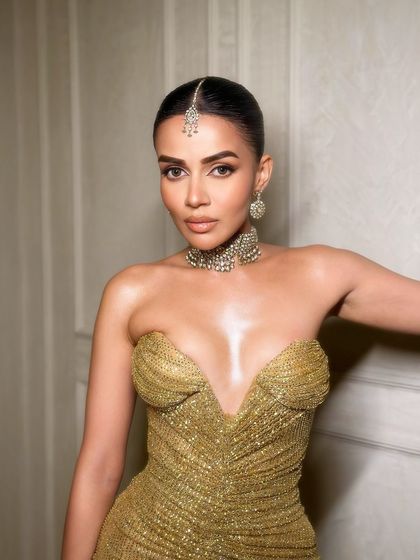 Dripped in gold. A stunning portrait of Komal in a metallic gold dress, with makeup to match.